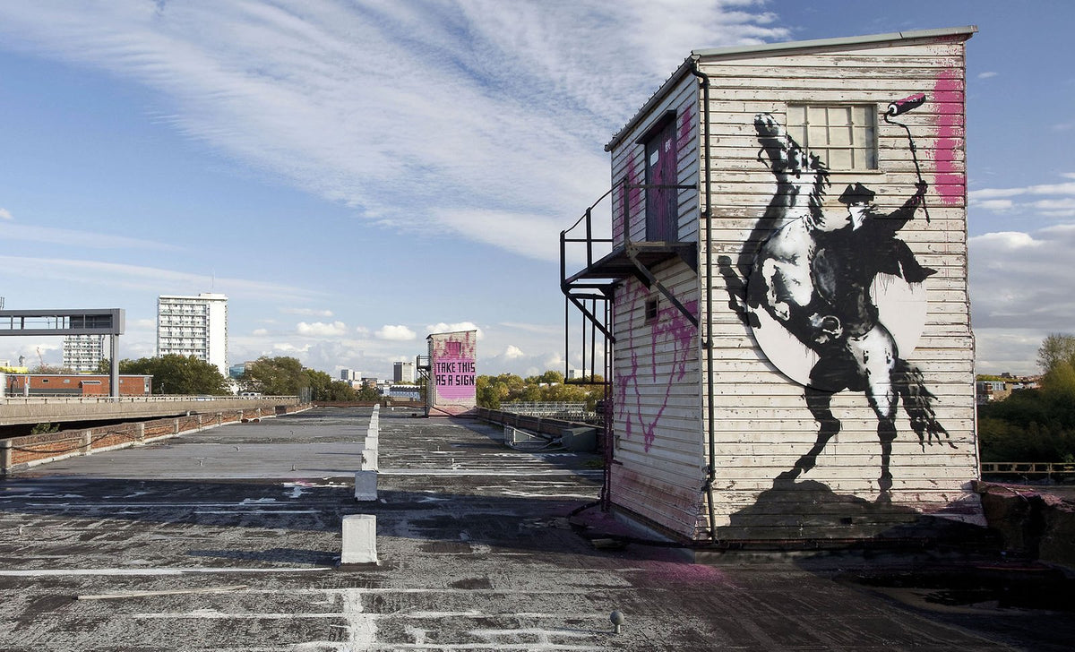 Banksy street artwork on a rooftop, from Richard Hessink’s catalogue website